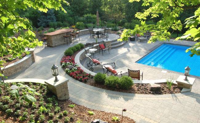 Hardscaping and landscaping around a pool