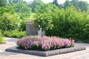 Stone centerpiece with planted annuals and Hibiscus