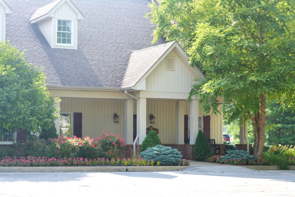 Entryway with professional flower bed maintenance
