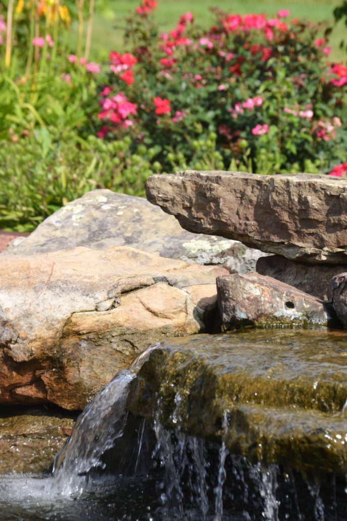 Close up waterfall, water trickling down stone